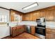 Kitchen featuring wood cabinets, stainless steel appliances, hardwood floors, and granite countertops at 1560 Springlake Rd, York, SC 29745