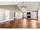 The living room features hardwood floors, a vaulted ceiling, a ceiling fan, and a fireplace at 1560 Springlake Rd, York, SC 29745