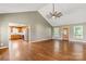 Spacious living room boasts an open layout with vaulted ceiling, ceiling fan, and hardwood floors at 1560 Springlake Rd, York, SC 29745