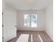 Bright bedroom featuring neutral carpet, a double window, and a view of the neighborhood at 1817 Augustine St, Monroe, NC 28112