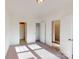 Spacious bedroom featuring neutral carpet, closet space, and multiple doorways under a ceiling light at 1817 Augustine St, Monroe, NC 28112