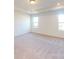 Spacious bedroom with plush carpeting and bright windows allowing for lots of natural light at 1817 Augustine St, Monroe, NC 28112