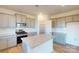 Well-lit kitchen features stainless steel appliances, light gray cabinetry, and granite countertops at 1817 Augustine St, Monroe, NC 28112