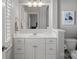 Clean, bright bathroom featuring a white vanity, a large mirror, and modern fixtures at 18823 Peninsula Cove Ln, Cornelius, NC 28031