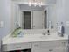 Well-lit bathroom with white cabinets, granite countertop, and chrome fixtures at 18823 Peninsula Cove Ln, Cornelius, NC 28031