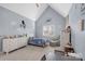 Bright bedroom with vaulted ceilings, airplane art, and a large window at 18823 Peninsula Cove Ln, Cornelius, NC 28031
