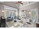 Stylish office with a vaulted ceiling, lots of natural light, modern decor, and a comfortable seating area at 18823 Peninsula Cove Ln, Cornelius, NC 28031