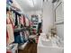 Spacious walk-in closet with ample shelving, hanging space, and organized storage solutions at 18823 Peninsula Cove Ln, Cornelius, NC 28031