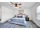 Bedroom featuring soft, neutral colors, a gray fabric headboard and a ceiling fan with decorative lighting at 1924 Lakeview Dr, Rock Hill, SC 29732
