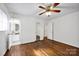 Bright bedroom features hardwood floors, and doors to the bathroom creating a tranquil retreat at 1924 Lakeview Dr, Rock Hill, SC 29732