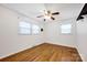 Bright bedroom with ceiling fan, hardwood floors, and natural light from windows, creating a welcoming space at 1924 Lakeview Dr, Rock Hill, SC 29732