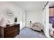Foyer with a dark wood credenza, decorative chair and a view to the front door and a half bathroom at 1924 Lakeview Dr, Rock Hill, SC 29732