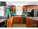 This remodeled kitchen showcases wood cabinetry and stainless steel appliances at 1924 Lakeview Dr, Rock Hill, SC 29732