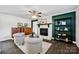 Charming living room with a brick fireplace, built-in shelving, and cozy seating at 1924 Lakeview Dr, Rock Hill, SC 29732