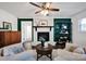 Inviting living room featuring a white fireplace, dark green accent wall, and stylish decor at 1924 Lakeview Dr, Rock Hill, SC 29732