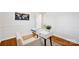 Bright home office boasts hardwood floors, white walls, a modern desk and chair, and decorative world map at 1924 Lakeview Dr, Rock Hill, SC 29732