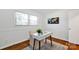 Bright home office features hardwood floors, white walls, and a modern desk with natural lighting from the window at 1924 Lakeview Dr, Rock Hill, SC 29732
