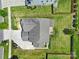 Aerial view of a property showing the roof, driveway, and landscaping at 2015 Knocktree Dr, Indian Trail, NC 28079