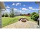 Spacious backyard with a stone patio and a built-in fire pit area at 2015 Knocktree Dr, Indian Trail, NC 28079