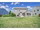 Large, green backyard featuring a patio, stone fire pit and well-maintained lawn at 2015 Knocktree Dr, Indian Trail, NC 28079