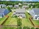 Picture of a well-maintained backyard with a privacy fence, patio, and mature landscaping in a residential neighborhood at 2015 Knocktree Dr, Indian Trail, NC 28079