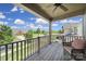 Inviting covered balcony with a cozy chair overlooking the beautiful neighborhood at 2015 Knocktree Dr, Indian Trail, NC 28079