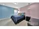 This bedroom has dual paint, two pendant lights, and a single window at 2015 Knocktree Dr, Indian Trail, NC 28079