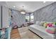 Cozy bedroom showcases a textured wall design and ample natural light at 2015 Knocktree Dr, Indian Trail, NC 28079
