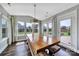 Well lit dining area with a rustic wooden dining table and outdoor views at 2015 Knocktree Dr, Indian Trail, NC 28079