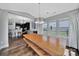 Dining area with an attached kitchen and breakfast nook with a wooden table and benches at 2015 Knocktree Dr, Indian Trail, NC 28079