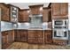 Well-equipped kitchen with custom cabinetry, stainless steel appliances, and stylish backsplash at 2015 Knocktree Dr, Indian Trail, NC 28079