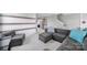 Comfortable living room with a large gray sectional, ottoman, and gray armchair at 2015 Knocktree Dr, Indian Trail, NC 28079