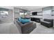 Cozy living room with large gray sectional, television, and lots of natural light at 2015 Knocktree Dr, Indian Trail, NC 28079