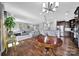 Bright open floor plan showcasing a modern living room, kitchen, and an adjacent dining space at 2015 Knocktree Dr, Indian Trail, NC 28079