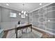 Modern office space with custom trim work, a stylish chandelier, and hardwood floors at 2015 Knocktree Dr, Indian Trail, NC 28079