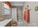 Cozy bathroom featuring a walk-in shower with grab bars and modern fixtures at 206 Cedarwood Dr, Salisbury, NC 28147