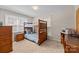 Functional bedroom with bunk beds, a workspace, and natural light creating a versatile living area at 206 Cedarwood Dr, Salisbury, NC 28147