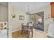 Cozy dining area featuring chandelier, table with seating, and sliding glass doors to the outdoor patio at 206 Cedarwood Dr, Salisbury, NC 28147