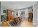 Formal dining room featuring hardwood floors, a chandelier, and a large window at 206 Cedarwood Dr, Salisbury, NC 28147