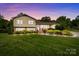 Charming two-story home featuring a landscaped yard and a blend of brick and siding at 206 Cedarwood Dr, Salisbury, NC 28147