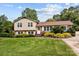Charming two-story home with brick accents and a well-manicured lawn, perfect curb appeal at 206 Cedarwood Dr, Salisbury, NC 28147