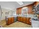 Modern kitchen with wooden cabinets, stainless steel appliances, and adjacent dining area creating an open layout at 206 Cedarwood Dr, Salisbury, NC 28147