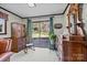 Living room boasts a wooden rocking chair, cabinet, and view of the backyard at 206 Cedarwood Dr, Salisbury, NC 28147