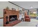 Inviting living room featuring a brick fireplace and plush leather armchair at 206 Cedarwood Dr, Salisbury, NC 28147