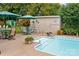 Close-up view of the refreshing in-ground pool, surrounded by a patio, landscaping and sitting area at 206 Cedarwood Dr, Salisbury, NC 28147