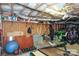 Basement area showing storage shelving, gym equipment, and open space for activities at 2124 Chatham Ave, Charlotte, NC 28205