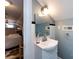 Bathroom featuring a sleek sink, classic tile, and view to an adjoining bedroom at 2124 Chatham Ave, Charlotte, NC 28205