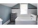 Bathroom features tub, tile detail, and ample space at 2124 Chatham Ave, Charlotte, NC 28205