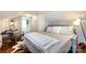 Cozy bedroom featuring hardwood floors, comfortable furnishings, and a relaxing ambiance at 2124 Chatham Ave, Charlotte, NC 28205