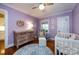 Charming Bedroom with a crib, changing table and hardwood floors at 2124 Chatham Ave, Charlotte, NC 28205